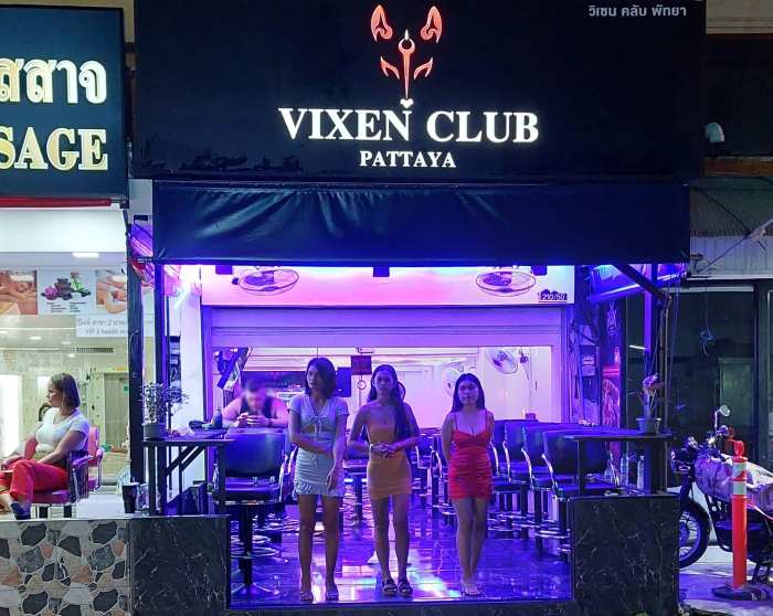 3 bar girls standing at the entrance of a bar bar on Soi Bukhao, Pattaya 