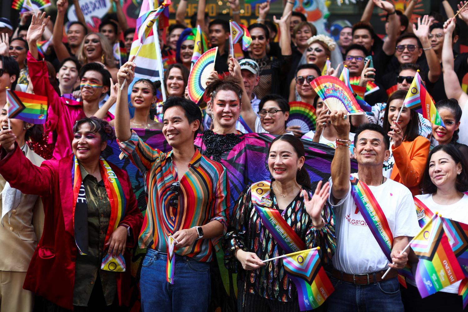 Move Forward Party leader Pita Limjaroenrat, front row, second left, and Pheu Thai's Paetongtarn Shinawatra, third from right, take part in the annual LGBTQ Pride parade in Bangkok on June 4. (Photo: Reuters)