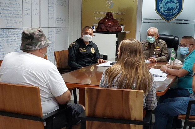 Pattaya police question Frenchman Herve Christian Robert Leonard (left) on Saturday on fraud allegations. (Photo: Chaiyot Pupattanapong)