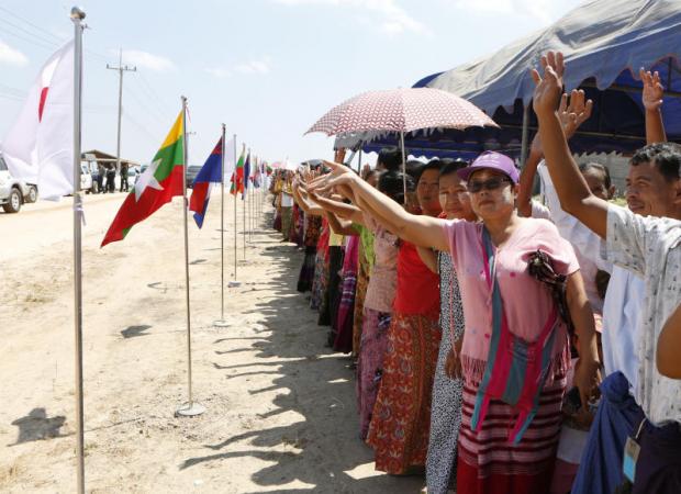 Right  Residents of Lay Kay Kaw village greet visitors inspecting community reconstruction through the Nippon Foundation's rehabilitation programme. Pattarapong Chatpattarasill