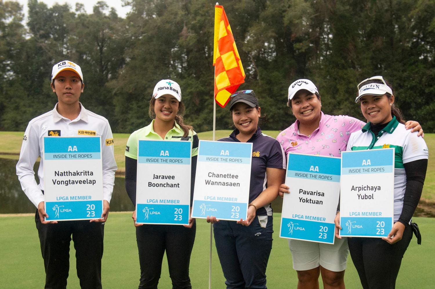 Thai players, from left, Natthakritta Vongtaveelap, Jaravee Boonchant, Chanettee Wannasaen, Pavarisa Yoktuan and Arpichaya Yubol with their LPGA cards. (AFP photo)