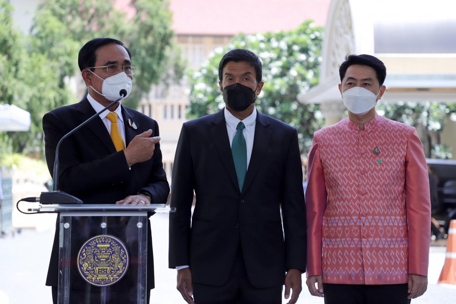 Prime Minister Prayut Chan-o-cha, left, is accompanied by Bangkok governor Chadchart Sittipunt and newly elected Pattaya mayor Poramase Ngamphiches, right, at a press briefing after attending the Centre for Covid-19 Situation Administration's meeting at Government House yesterday. (Photo: Chanat Katanyu)