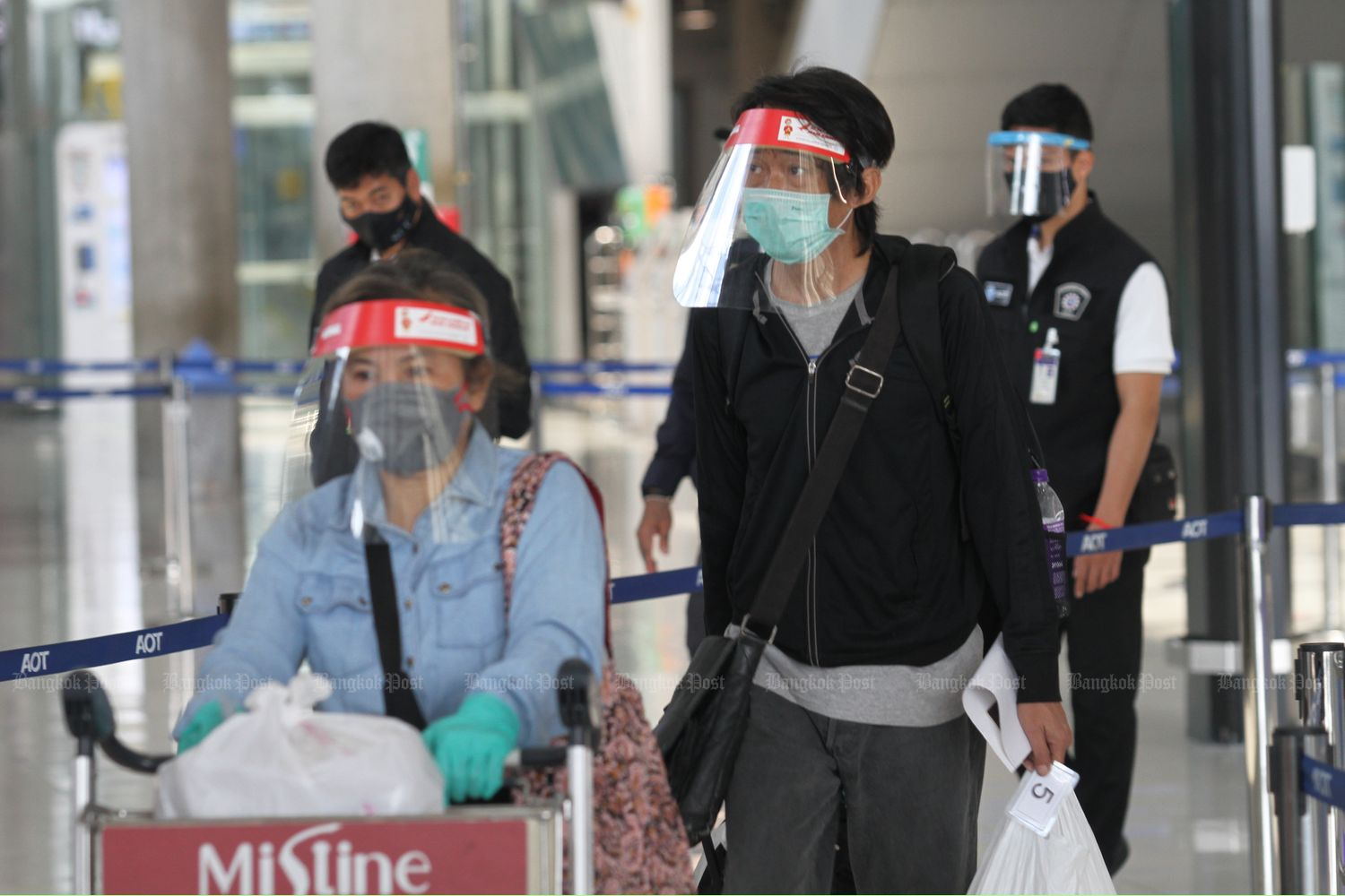 Some of the 35 Thais returning home from India are processed at Suvarnabhumi airport upon landing on Wednesday afternoon. All but one were sent to state quarantine at Chor Cher - The Green Residence hotel in Samut Prakan province. The other with a slight fever was sent to a hospital. (Photo by Nutthawat Wicheanbut)