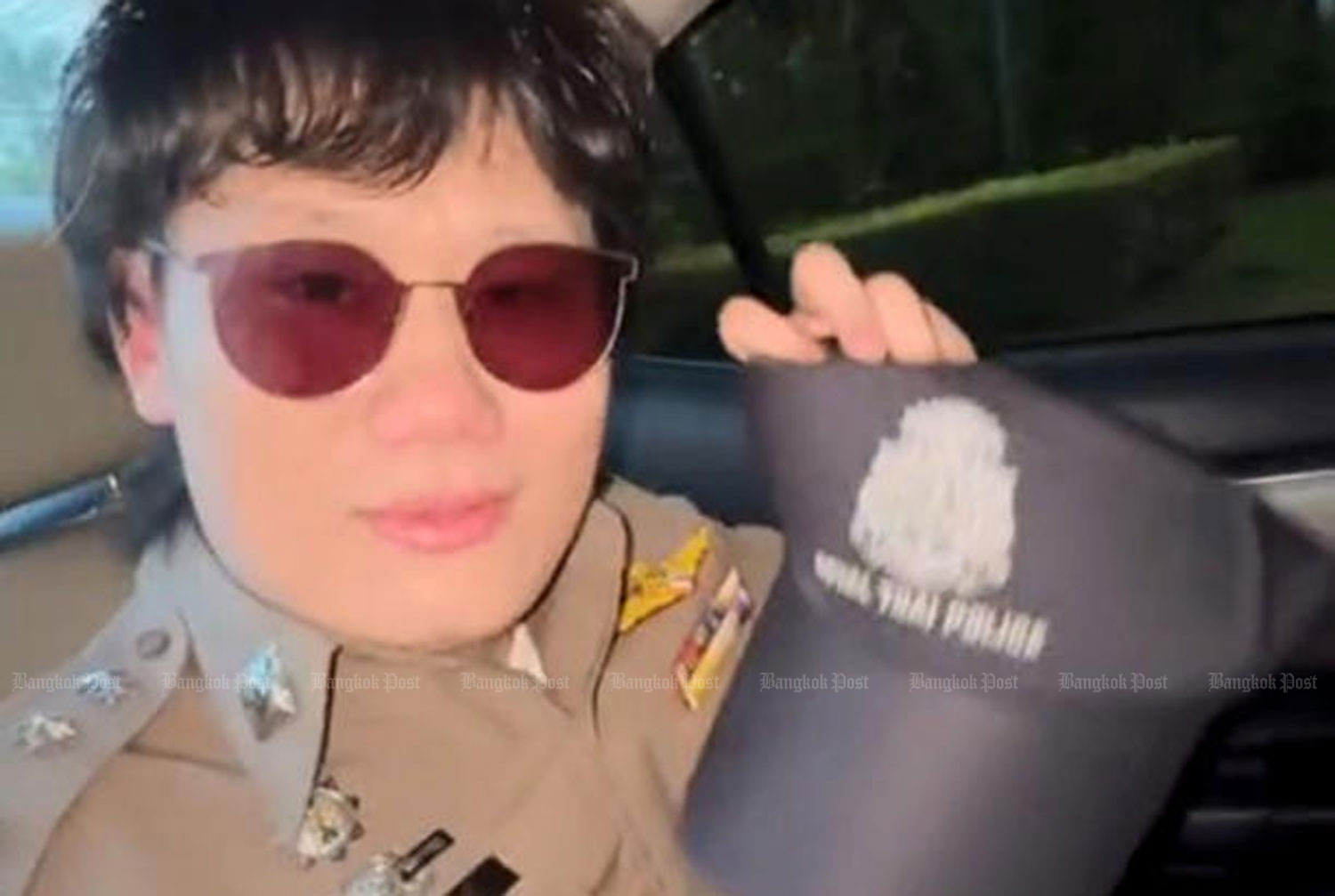 A Chinese tourist wears a Thai police uniform. (TV screen capture)